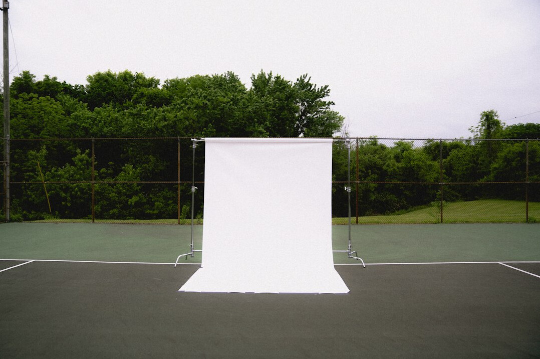 Preparing a lit background and backdrop in a studio